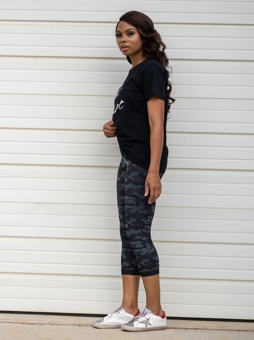 [Snapback™ Postpartum Crop Leggings - Black Camo (2 Pack)] - [Lifestyle Side View]